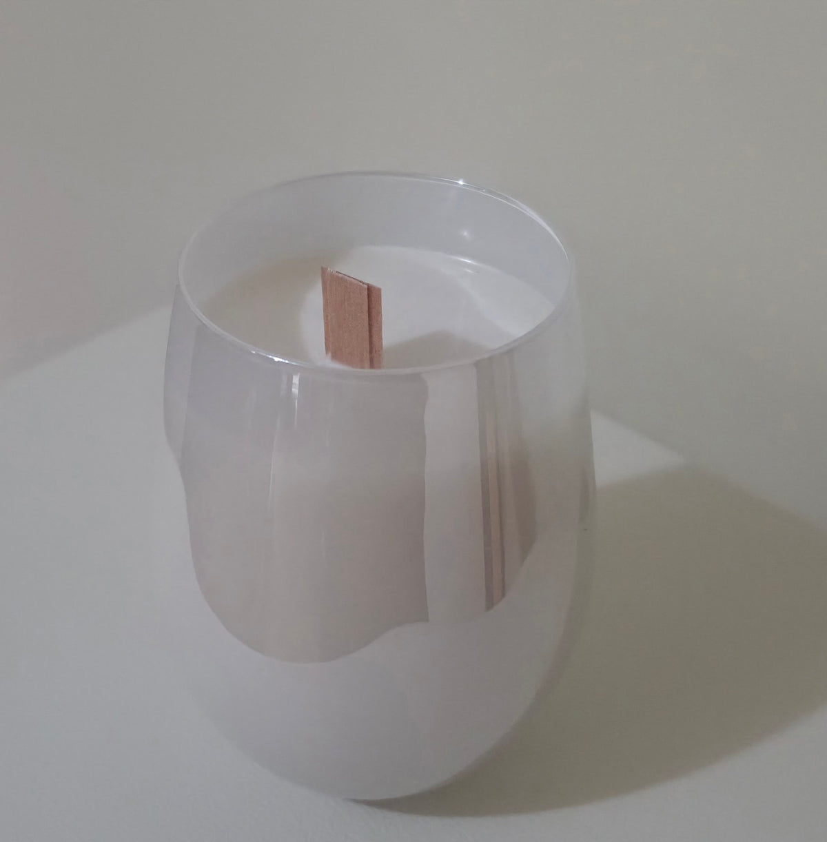 Serenus Spa Large cocosoy candle in a pearlised glass jar with white wax and a wooden wick.